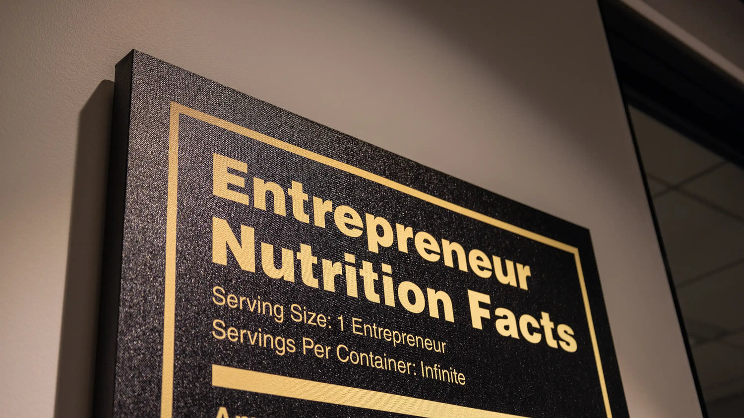 Entrepreneur Nutrition Facts Wall Art on the office wall. 