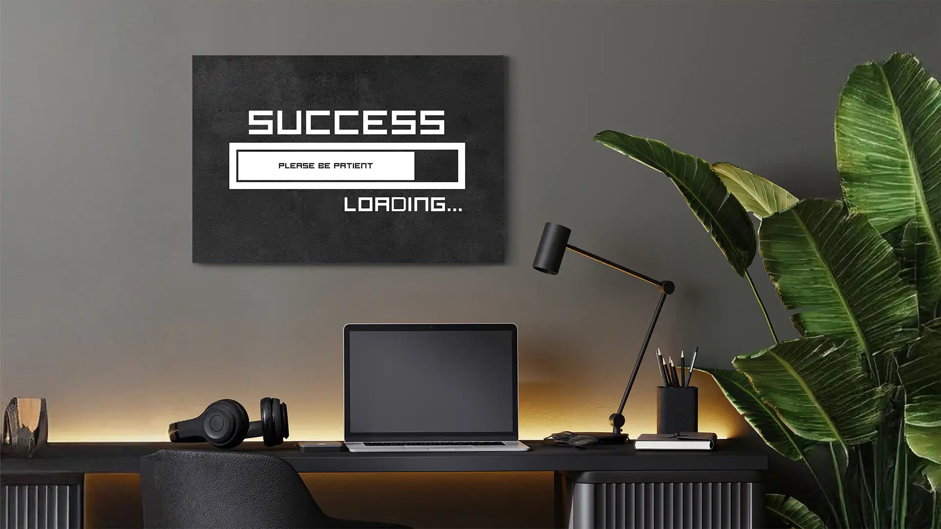 Success Loading canvas wall art behind Computer desk in a office.